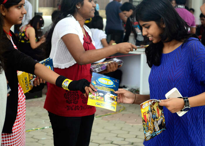 This image shows a person giving a pamphlet to another on the street