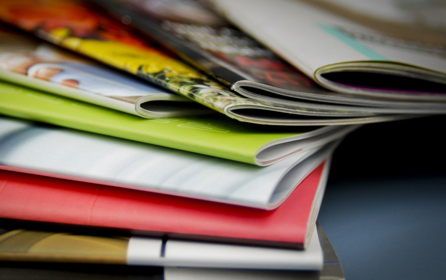 Picture showing a lot of magazines for reaching potential clients.