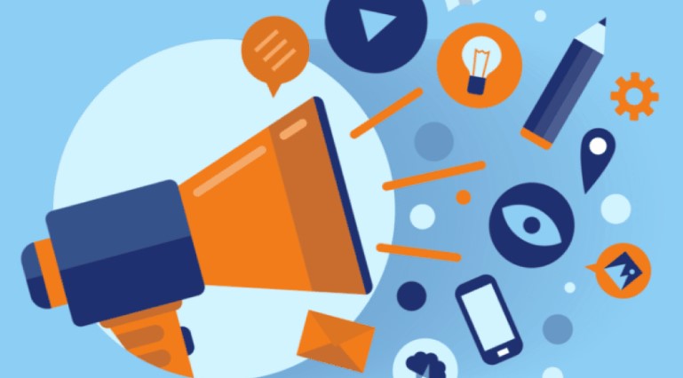 A picture showing offline marketing via a speaker and a few other elements like a phone, pencil etc.