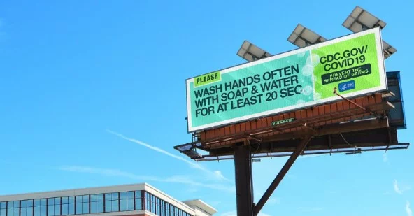 Poster showing pandemic message via traditional advertising methods