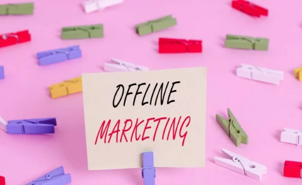 the image of different colored clips with a poster in the middle