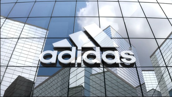 This image shows the logo of Adidas on a building