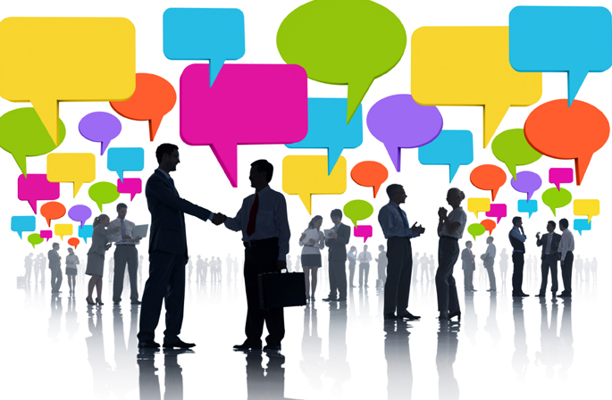 A picture showing a few people in formal outfits.