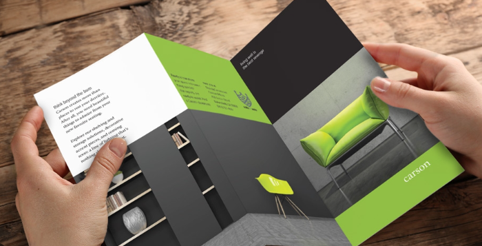 Image showing offline advertising via a man holding a brochure.