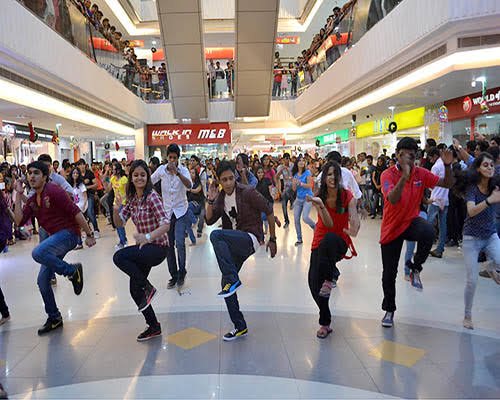 The picture shows a flash mob in a mall