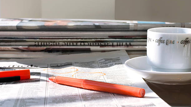 Highlighting job updates with red pen.