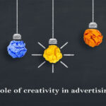 Five coloured bulbs on a black background.