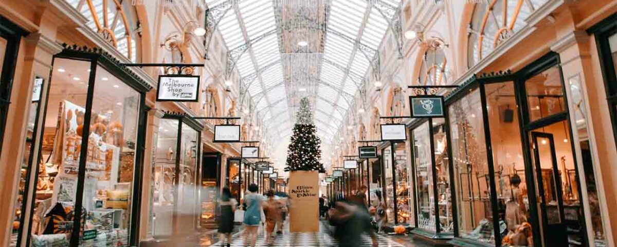 Display boards promoting various shops in the mall.