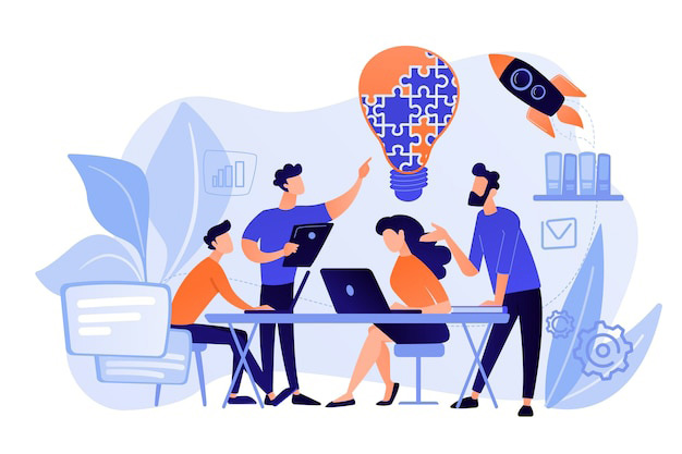 A group of four people brainstorming ideas.