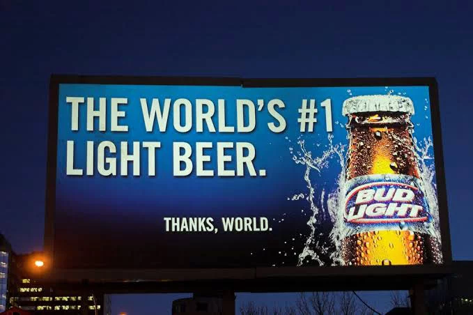A backlit Billboard advertising beer.