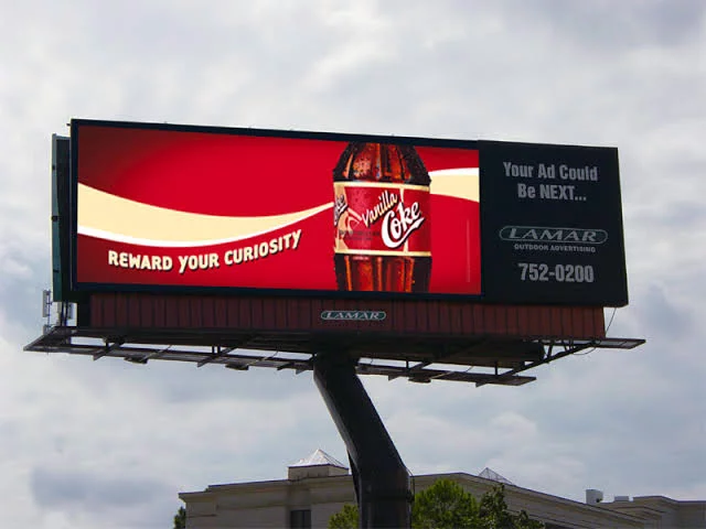 A digital billboard advertising coke.