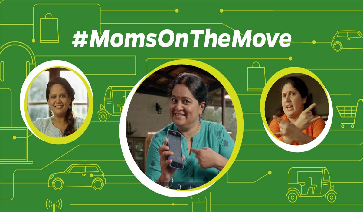 A mother using the Ola app on mobile.
