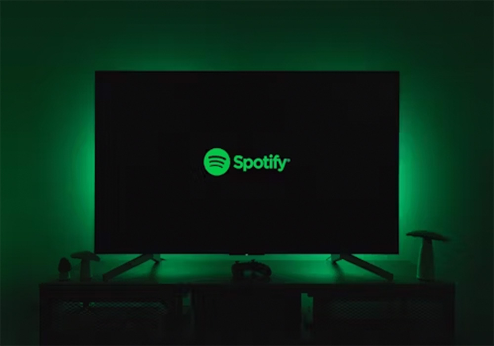 The Spotify icon on a monitor screen.