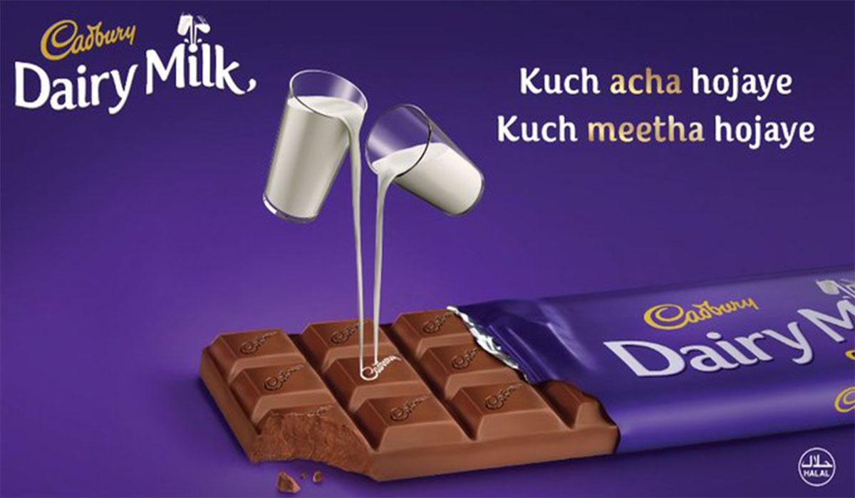 A cadbury dairy milk chocolate illustration with purple background, Cadbury logo, and ad tagline.