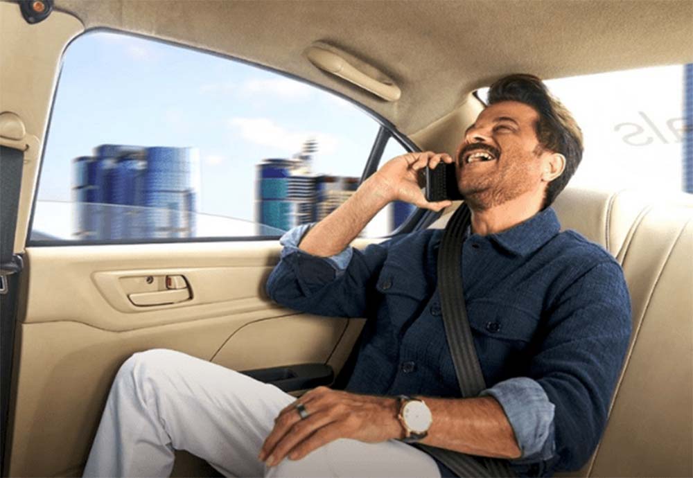 Popular bollywood actor Anil kapoor chilling while sitting at the back of Uber cabs.